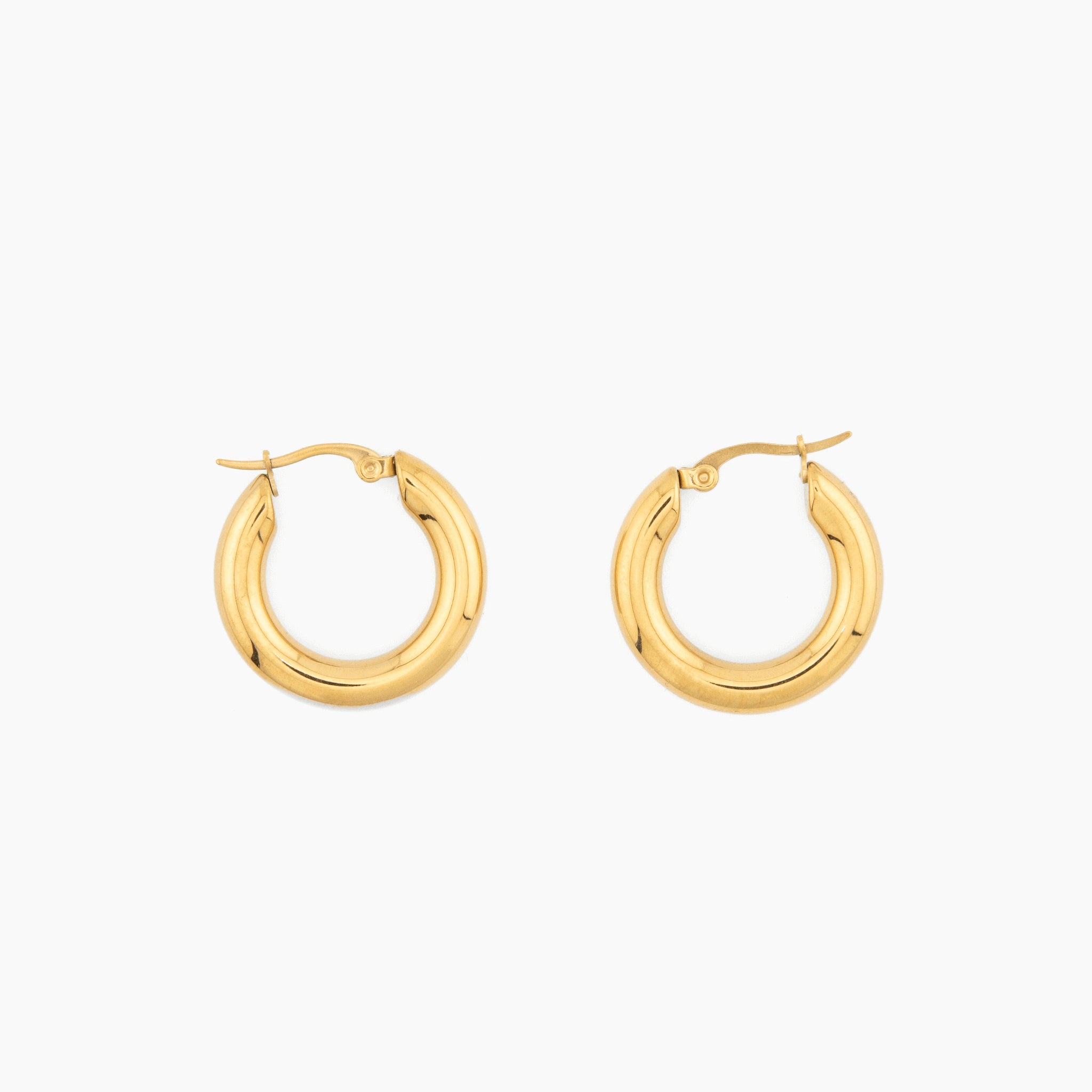pair of thick gold hoop earrings with rounded design