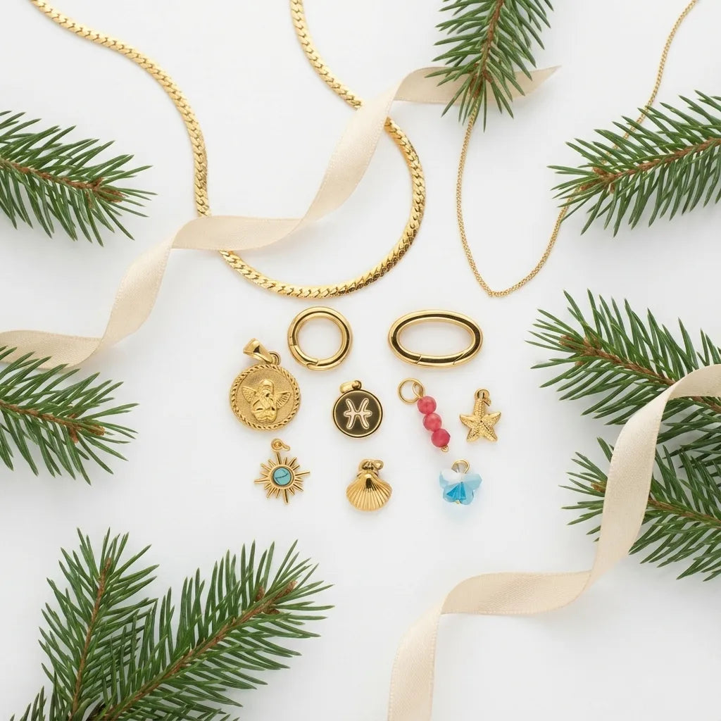 Gold jewelry set with pendants and clasps on a white background with green branches.