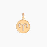 Golden pendant with aries zodiac symbol on a white background