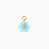 Blue flower-shaped charm with gold accents on a white background