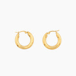 pair of thick gold hoop earrings with rounded design
