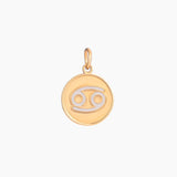 Golden pendant with cancer zodiac symbol on a white background