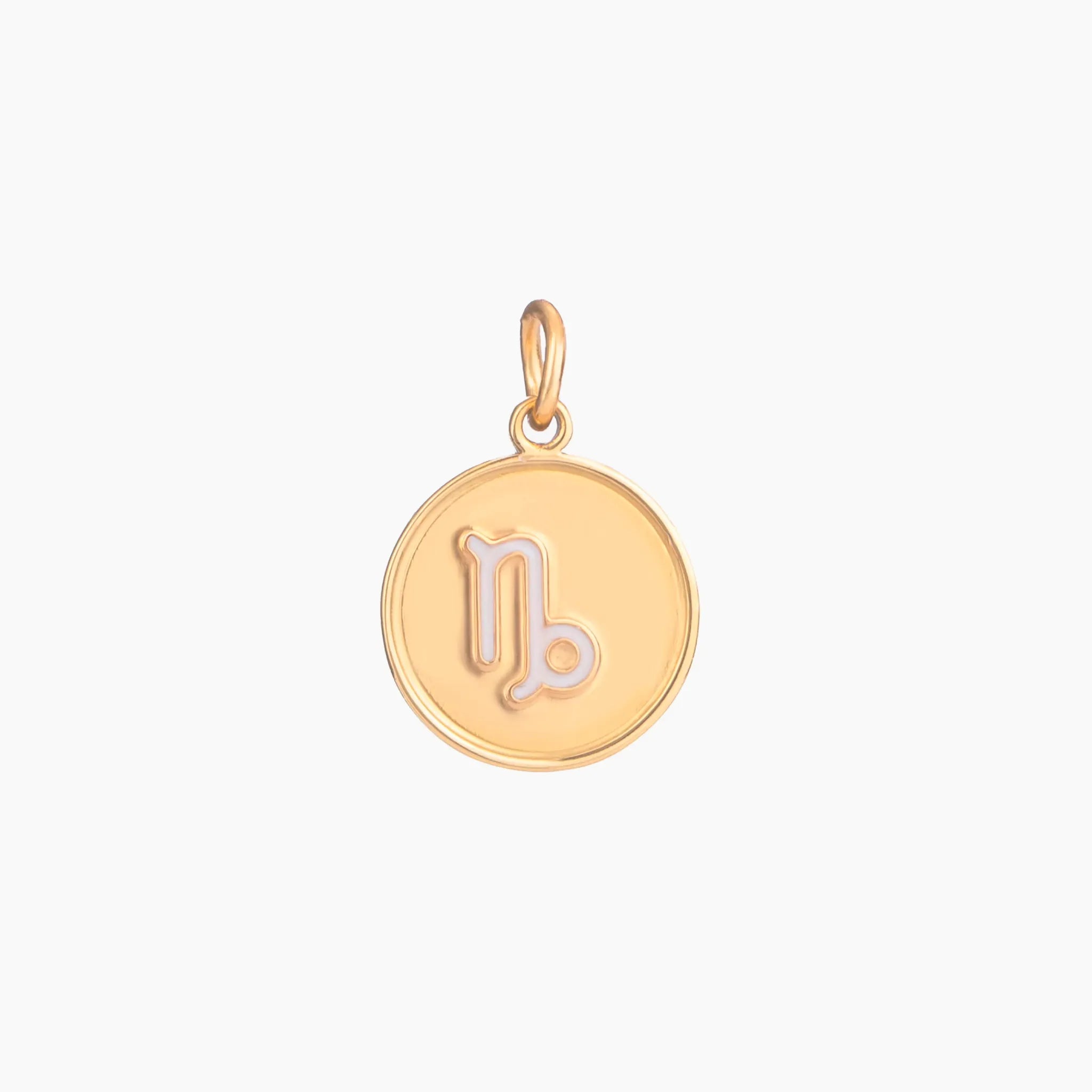 Golden pendant with capricorn zodiac symbol on a white background