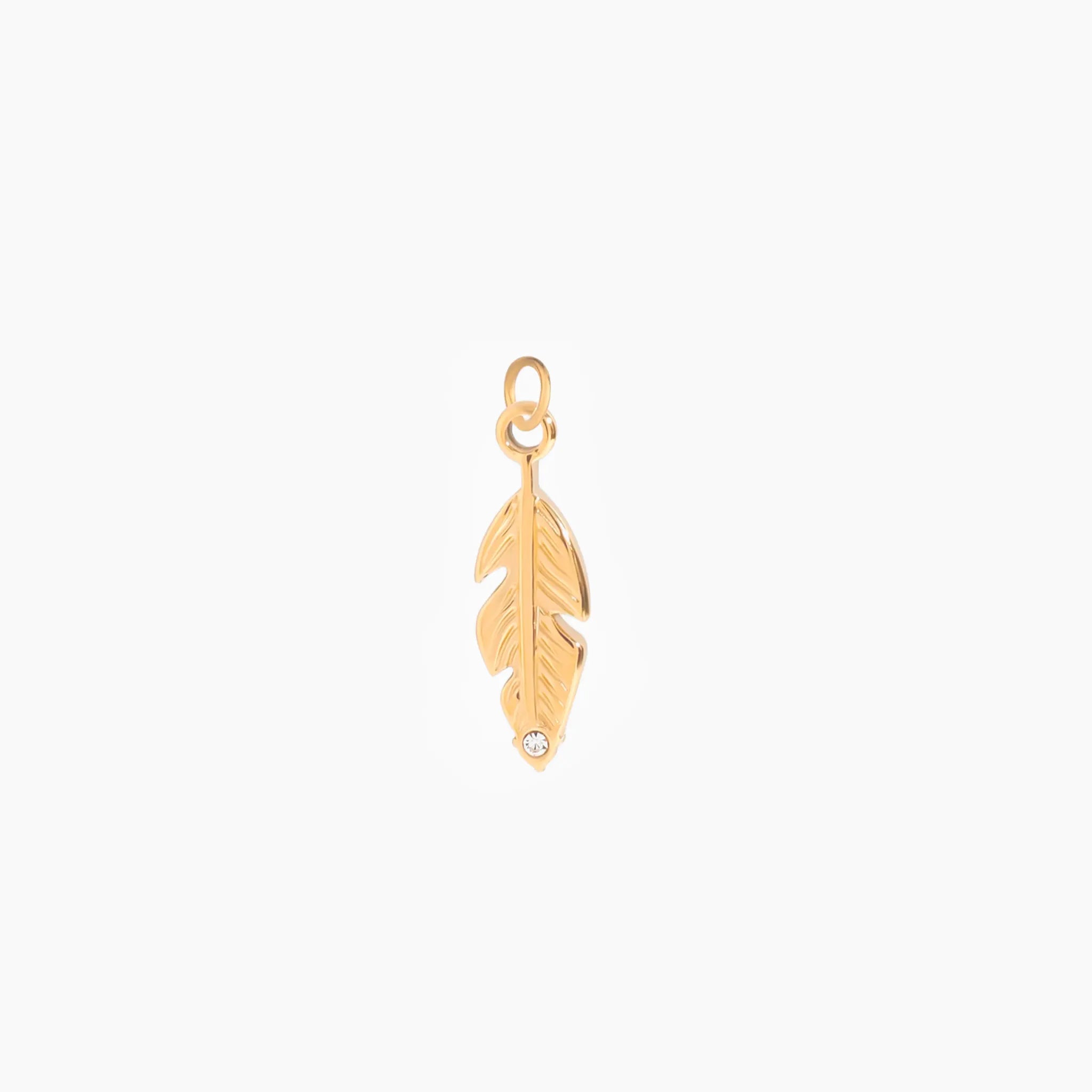 Golden feather pendant on a white background