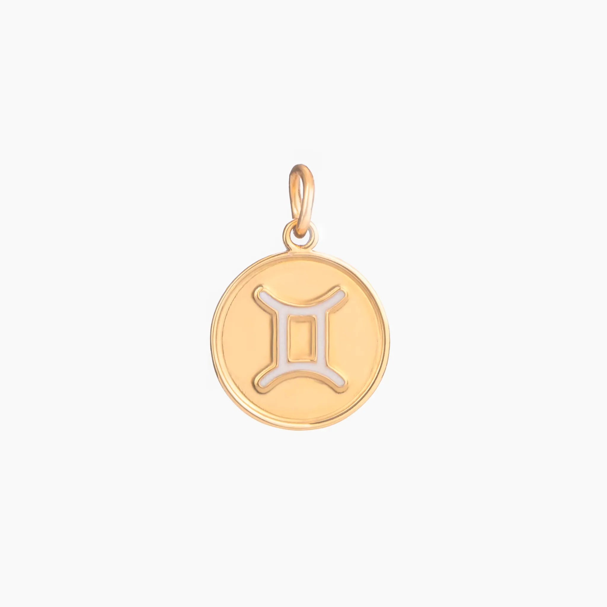 Golden pendant with gemini zodiac symbol on a white background