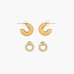 Set of golden earrings on a white background