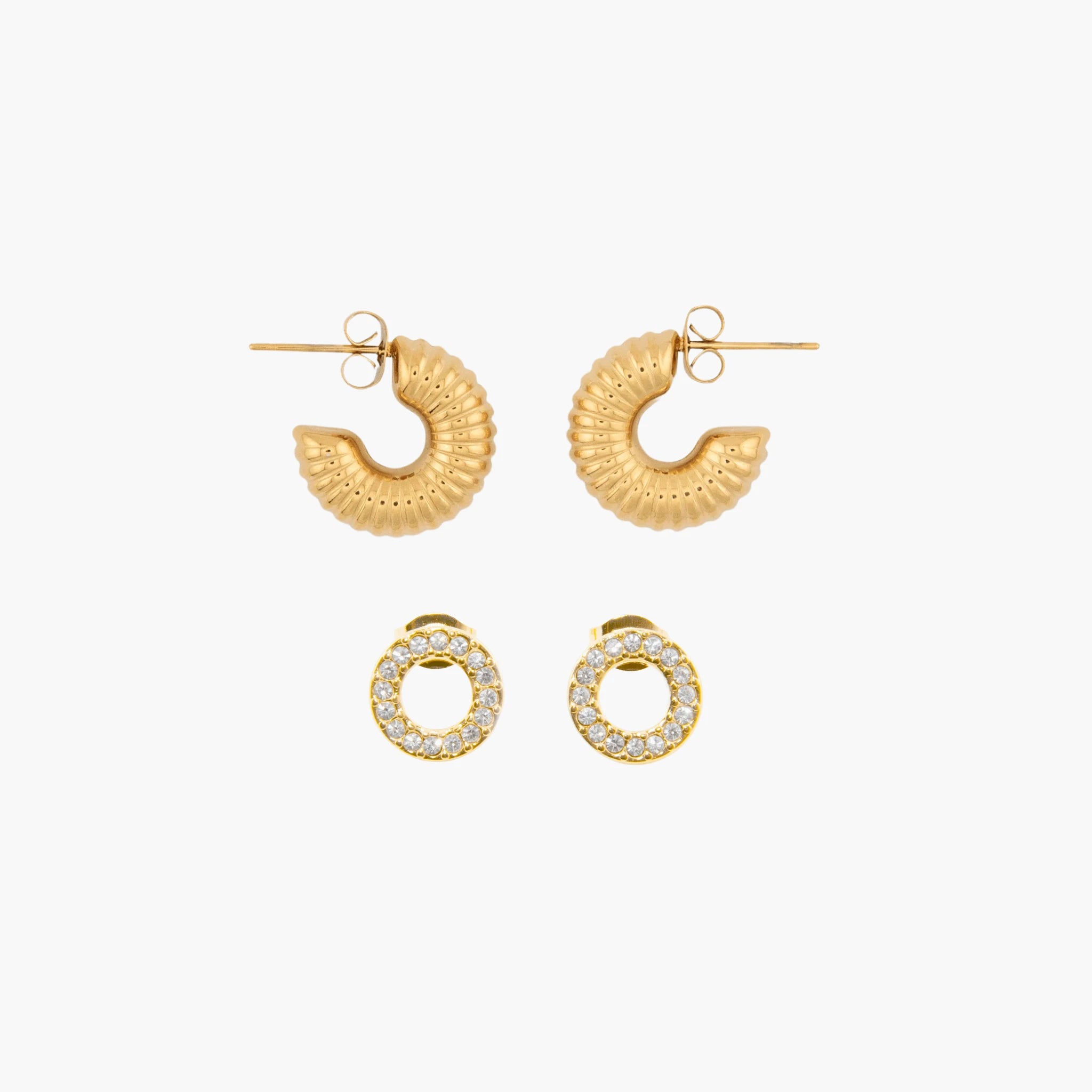 Set of golden earrings on a white background