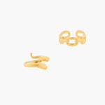Gold snake-shaped ring and chain link ring on a white background