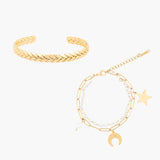 Two golden bracelets on a white background