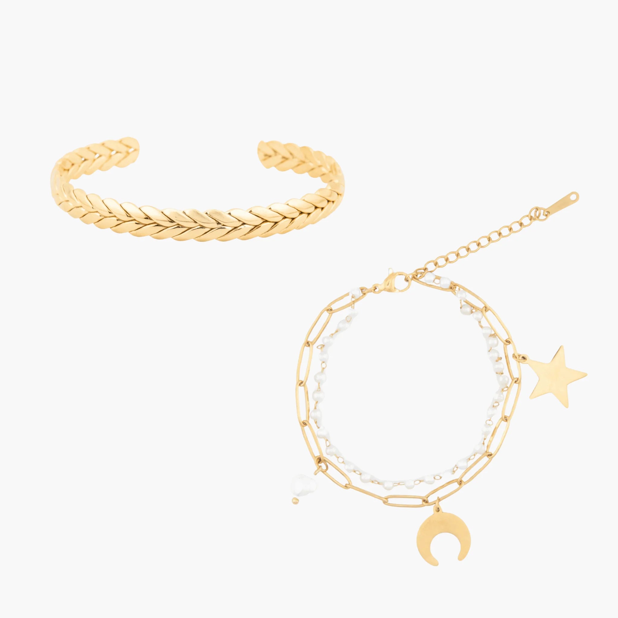 Two golden bracelets on a white background