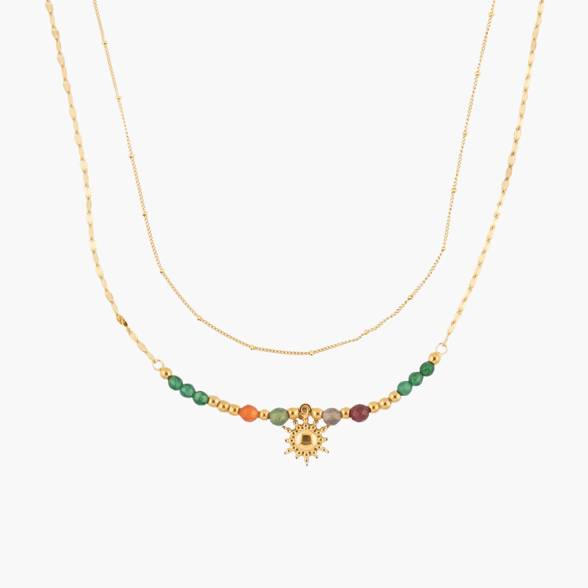 Golden necklace with colorful beads and a sun charm on a white background