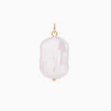 Large baroque pearl charm on a white background