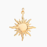 Golden large sun-shaped pendant on a white background