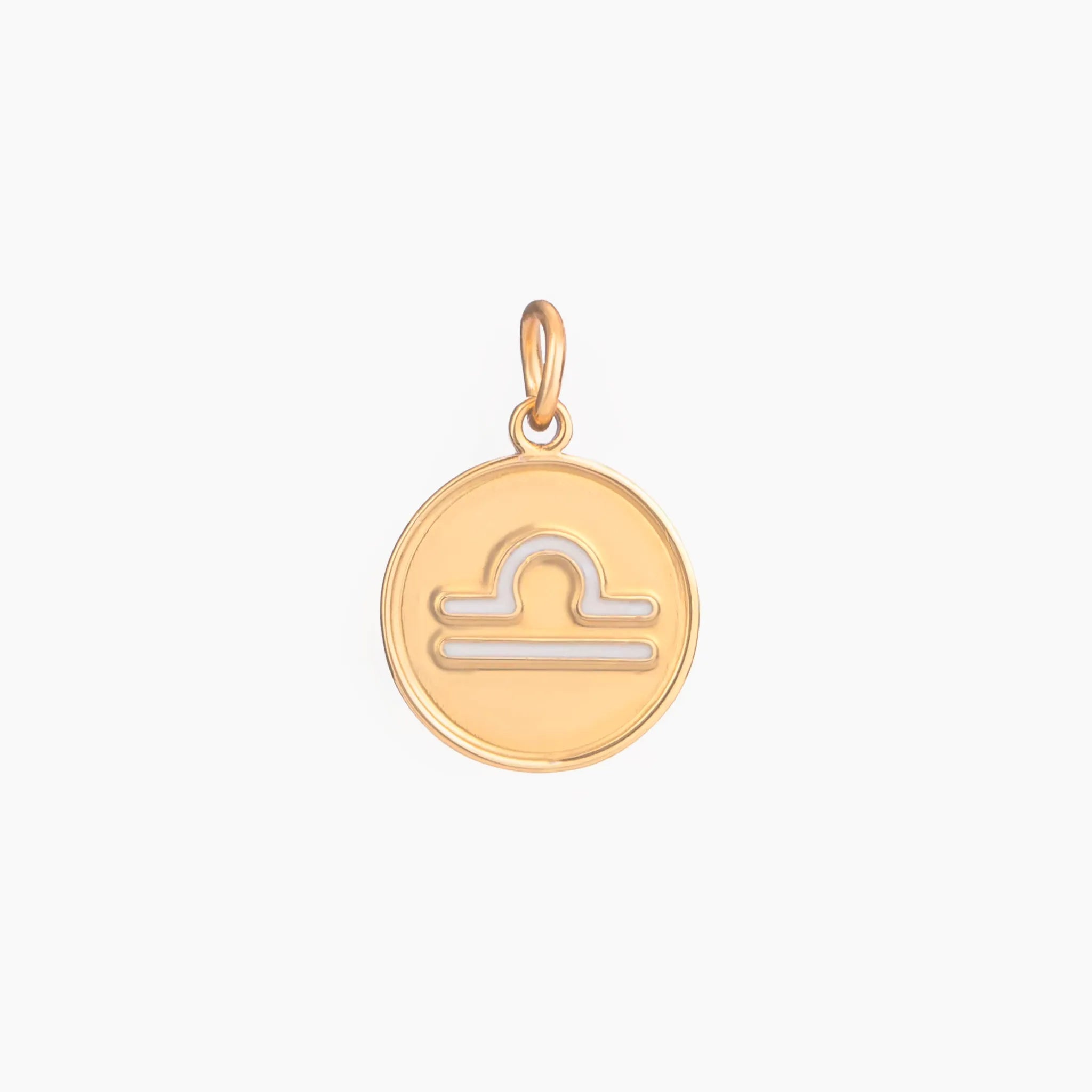 Golden pendant with libra zodiac symbol on a white background
