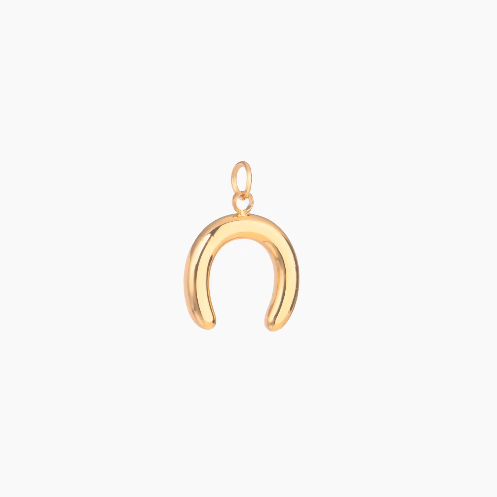 Gold horseshoe-shaped pendant on a white background