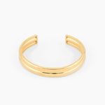open gold cuff bracelet with minimalist design