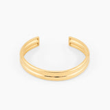 open gold cuff bracelet with minimalist design