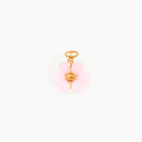 Pink flower charm on a white background