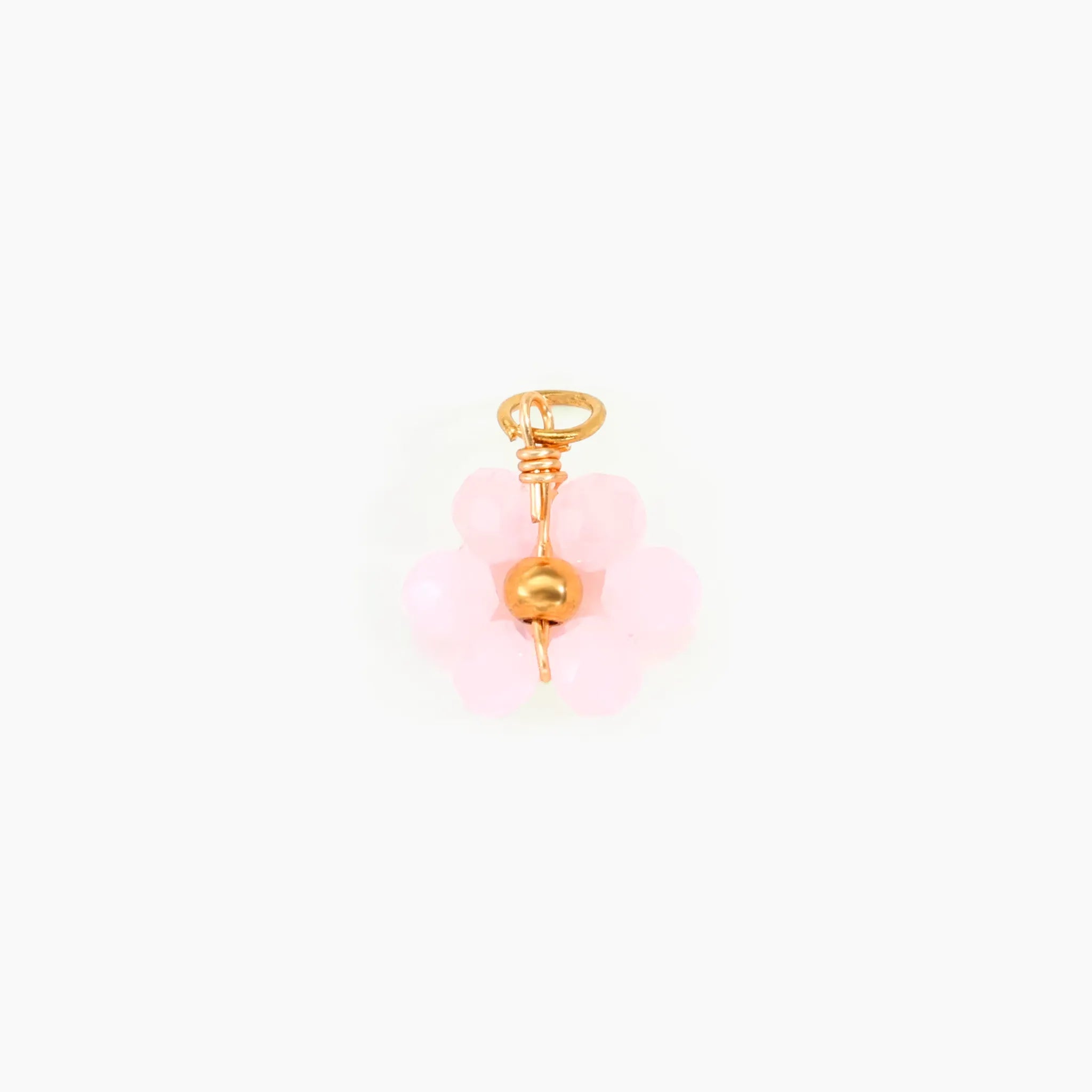Pink flower charm on a white background