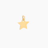 Golde small star-shaped pendant on a white background